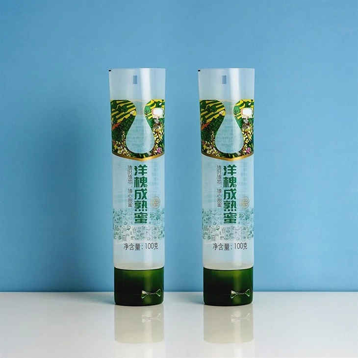 100g Custom Logo Cosmetic Packaging Squeeze Cosmetic Squeeze Container Plastic Food Grade Honey Packaging Tube